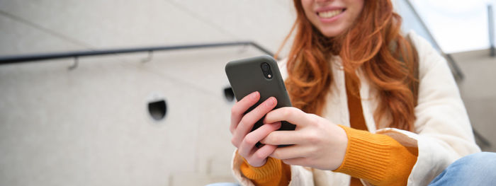 Young woman using mobile phone