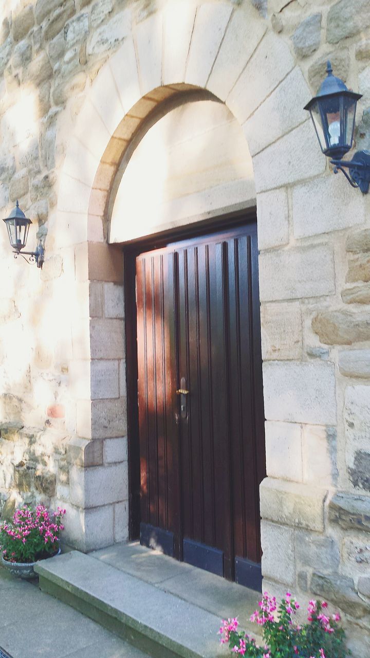 architecture, built structure, building exterior, door, entrance, wall - building feature, flower, closed, window, house, plant, wall, stone wall, gate, arch, brick wall, old, building, day, steps