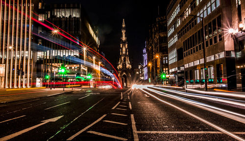 Light trails on road in city at night