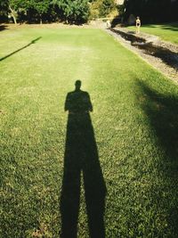 Shadow of people on grass