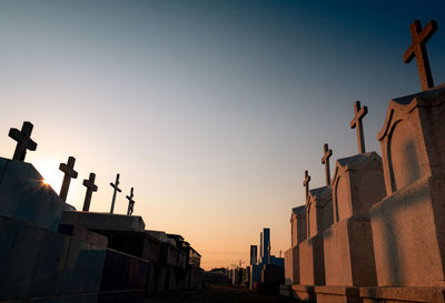 Cemetery or graveyard in the evening with sunset sky. headstone and cross tombstone cemetery. 