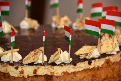 Close-up of small hungarian flags on cake