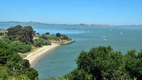 Scenic view of sea against clear blue sky