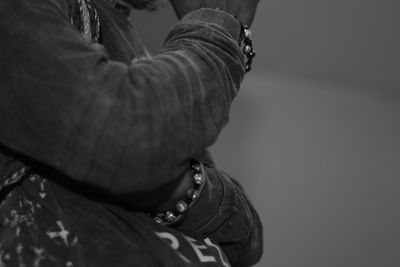 Close-up portrait of woman holding hands