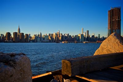 Sea with buildings in background