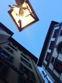 Low angle view of buildings against blue sky