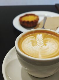 Close-up of cappuccino on table