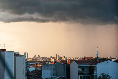 Cityscape against sky during sunset