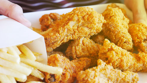 Close-up of hand served on plate