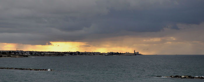 Panoramic view of sea against sky during sunset