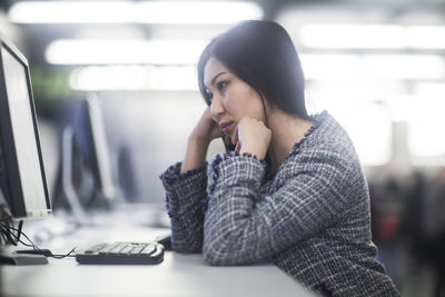 Young woman inside working concentrate