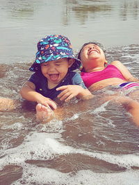 Portrait of happy boy on water