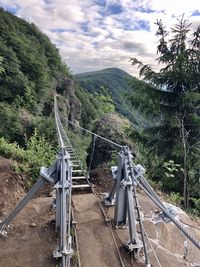 View of bridge on mountain against sky