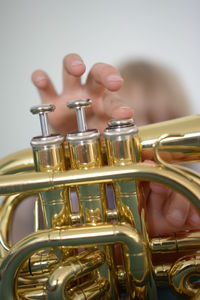 Close-up of hand holding trumpet