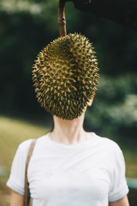 Rear view of woman against plants