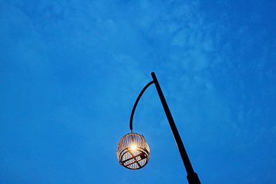 Low angle view of hanging against blue sky