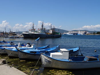 Boats moored at harbor