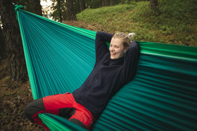 Woman relaxing on hammock