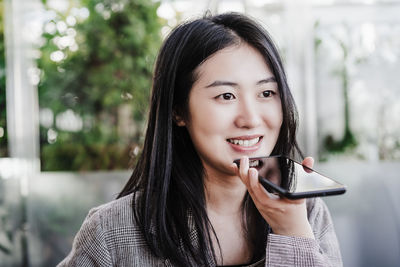 Young woman using mobile phone