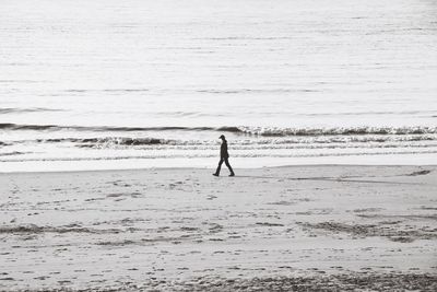 Full length of man walking on beach