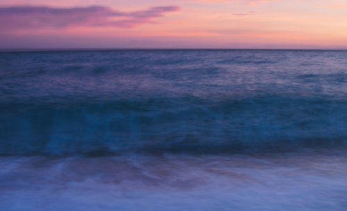 Scenic view of sea against sky at sunset