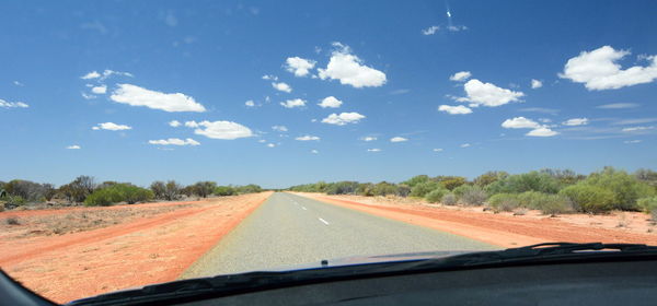 Road seen through car windshield
