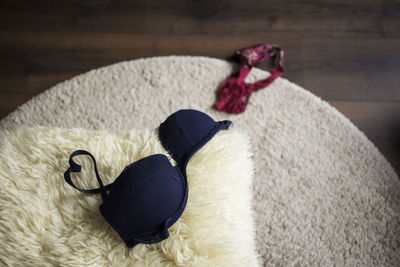 Close-up of lingerie on carpet at home
