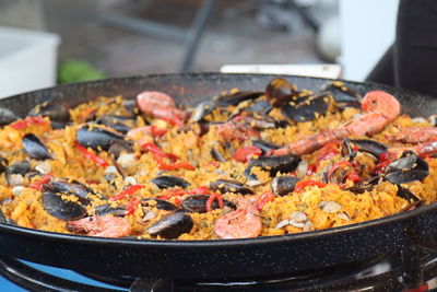 Fish and rice paella to cook in a pan