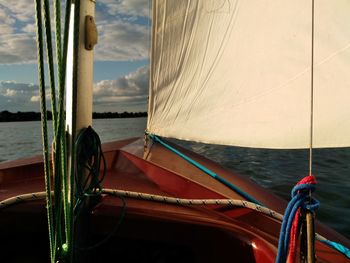 Boats moored in sea against sky