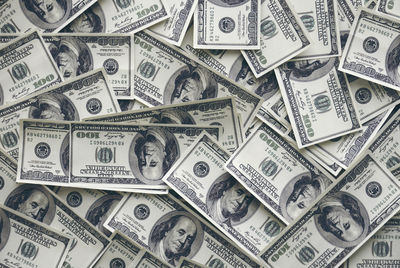 Full frame shot of paper currencies on table