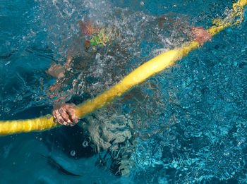 High angle view of person swimming in pool