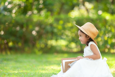 Portrait of a young woman sitting outdoors