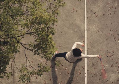 High angle view of girl playing badminton