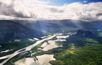 Aerial view of agricultural field against sky