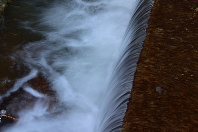 Close-up of waterfall against sky