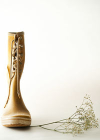 Close-up of decoration on table against white background