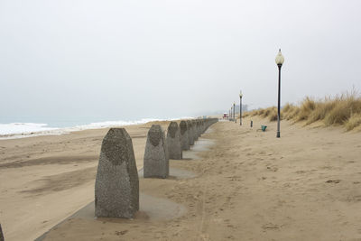 Scenic view of beach against clear sky