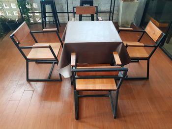High angle view of empty chairs and tables at home
