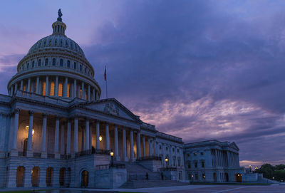 View of illuminated building against sky at dusk