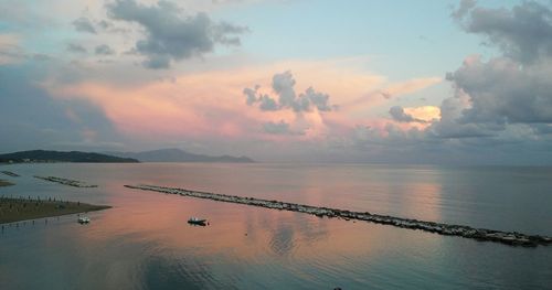 Scenic view of sea against cloudy sky