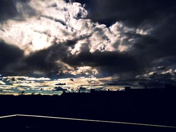 Scenic view of dramatic sky during sunset