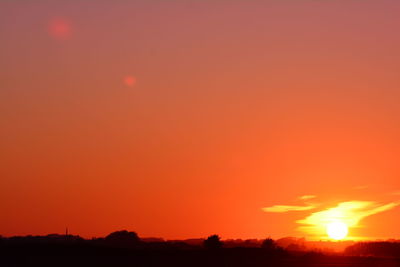 Scenic view of silhouette landscape against romantic sky at sunset