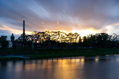 Scenic view of river against sky during sunset