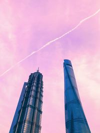 Low angle view of vapor trails in sky