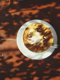 High angle view of cappuccino on table