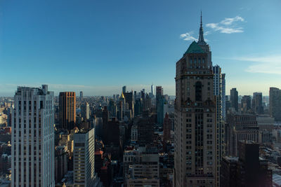 Modern buildings in city against sky