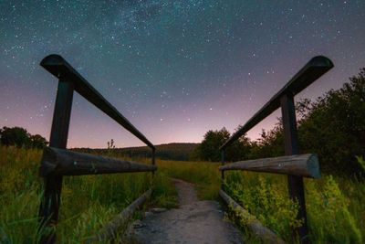 Scenic view of field against sky at night