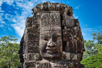 Low angle view of statue against sky