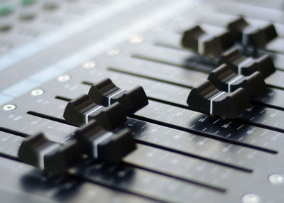 High angle view of sound mixer knobs