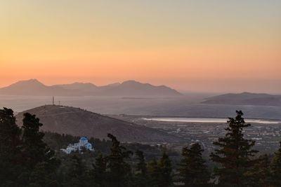 Scenic view of mountains against sky during sunset